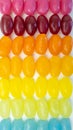 Colorful jelly beans rainbow colors. Vertical portrait mode background. Royalty Free Stock Photo