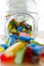 Colorful jelly candies in a bottle. Addiction concept. Royalty Free Stock Photo