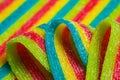 Colorful jelly candies strips in sugar sprinkles. Sour flavored rainbow candy background Royalty Free Stock Photo