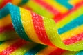 Colorful jelly candies strips in sugar sprinkles. Sour flavored rainbow candy background Royalty Free Stock Photo