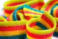 Colorful jelly candies strips in sugar sprinkles. Sour flavored rainbow candy background Royalty Free Stock Photo