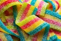 Colorful jelly candies strips in sugar sprinkles. Sour flavored rainbow candy background Royalty Free Stock Photo