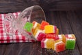 Colorful jelly candy in a glass vase on wooden background Royalty Free Stock Photo