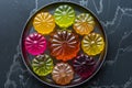 Colorful jelly desserts on a plate, assorted fruit flavors