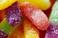 Colorful jelly marmalade worms, sweet delicious background. Light sweet dessert. Macro photo.