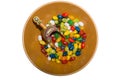 Colorful Jellybeans and Wooden Scoop in Bowl