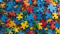 Colorful jigsaw puzzle pieces scattered on a flat surface. Autistic Pride Day