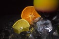 Colorful juice cocktail with straw on the black background.