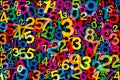 Jumbled colorful numbers, over black