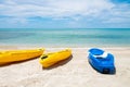 Colorful Kayak boat on tropical beach seaside with blue sky and cloud. Sport, recreation for tourist during holiday vacation Royalty Free Stock Photo