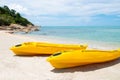 Colorful Kayak boat on tropical beach seaside with blue sky and cloud. Sport, recreation for tourist during holiday vacation Royalty Free Stock Photo