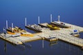 Colorful kayaks on a dock by a lake Royalty Free Stock Photo