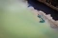 Colorful kayaks floating in green river under the cliff in the Parque Natural de las Hoces del RiÂ­o Duraton, Spain Royalty Free Stock Photo