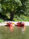 Colorful kayaks ready to kayaking in spring river water Royalty Free Stock Photo