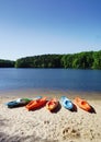 Colorful kayaks on the shore of Lake Johnson, a popular city park in Raleigh NC Royalty Free Stock Photo