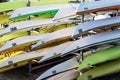 Colorful kayaks stacked in rows