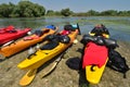 Colorful kayaks standing on riverbank Royalty Free Stock Photo