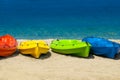Colorful kayaks on white sand on beach of Cyprus against of the blue sea background. Bright Summer Seascape Royalty Free Stock Photo