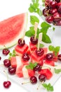 Colorful kebabs made with melon, watermelon and cherries