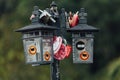 Colorful keychain holded on post lamp is called `Love Lock Penang Hill` from Penang Hill at George Town. Penang, Malaysia