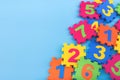 Colorful kids numbers toys on blue background