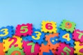 Colorful kids numbers toys on blue background