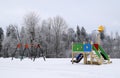 Kids playground on a snowy winter day. Royalty Free Stock Photo