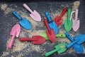 Colorful Kids shovels in a playground sandbox