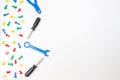 Colorful kids toys border. Plastic toy tools, bolts and nuts on white background. Top view Royalty Free Stock Photo