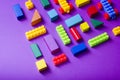 Colorful kids toys frame on wooden background. Top view. Flat lay. Copy space for text.