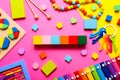 Colorful kids toys on pink background. Top view, flat lay. Royalty Free Stock Photo