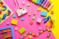 Colorful kids toys on pink background. Top view, flat lay. Royalty Free Stock Photo