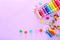 Colorful kids toys on purple background. Top view Royalty Free Stock Photo