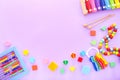 Colorful kids toys on purple background. Top view Royalty Free Stock Photo