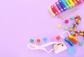 Colorful kids toys on purple background. Top view, flat lay. Royalty Free Stock Photo