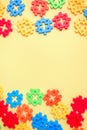 Colorful kids toys vertical frame on yellow background. Royalty Free Stock Photo