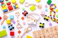 Colorful kids toys on white background. Top view, flat lay. Royalty Free Stock Photo