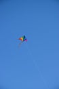 Colorful kite against blue sky Royalty Free Stock Photo