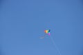 Colorful kite against blue sky Royalty Free Stock Photo