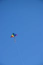 Colorful kite against blue sky Royalty Free Stock Photo