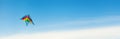 Colorful kite flying in the sky blue Royalty Free Stock Photo