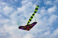 Colorful kite soaring on the blue cloudy sky.Summertime concept.Natural background Royalty Free Stock Photo