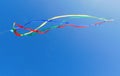 Colorful kite soars across a blue sky