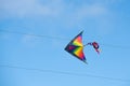 Colorful kite stuck in the electric power lines Royalty Free Stock Photo