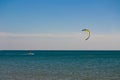Colorful kiteboard parachute in the blue sky. Kitesurfing, Kiteboarding, Kiteboarders concept. Kitesurfers surfing the wind on