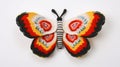 Colorful Knit Butterfly Toy With Mexican Muralism And Ndebele-inspired Motifs