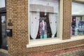 A colorful knitted coast surrounded by hearts on a street in a store of clothing store in Douglasville Georgia