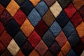 Colorful knitted patchwork displayed on a textured surface in a warm, cozy setting Royalty Free Stock Photo