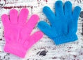 colorful little children winter glove on grunge wooden floor Royalty Free Stock Photo