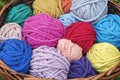 Colorful knitting wool balls in a wicker basket Royalty Free Stock Photo